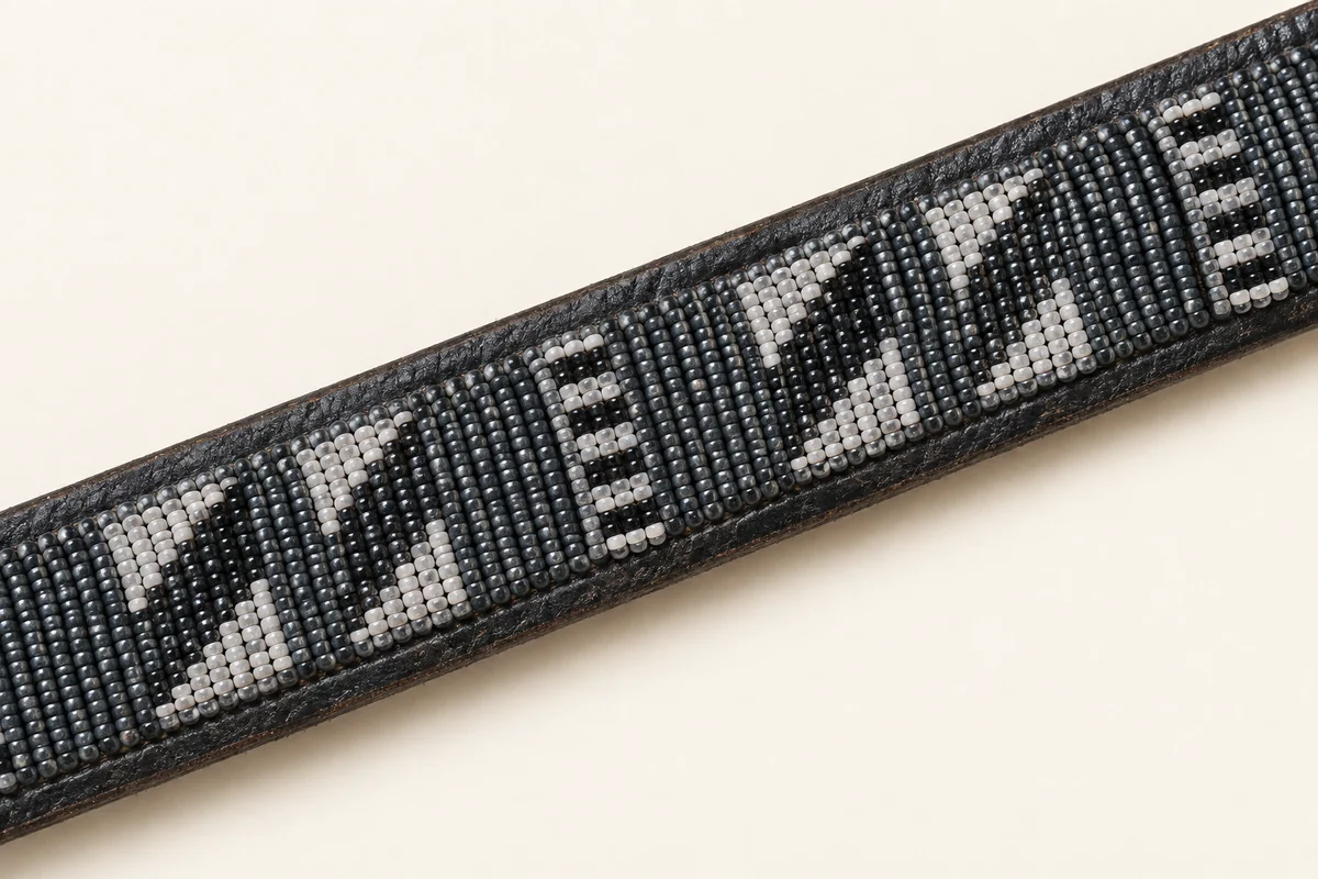 The Solio — fine monochrome beadwork on dark leather